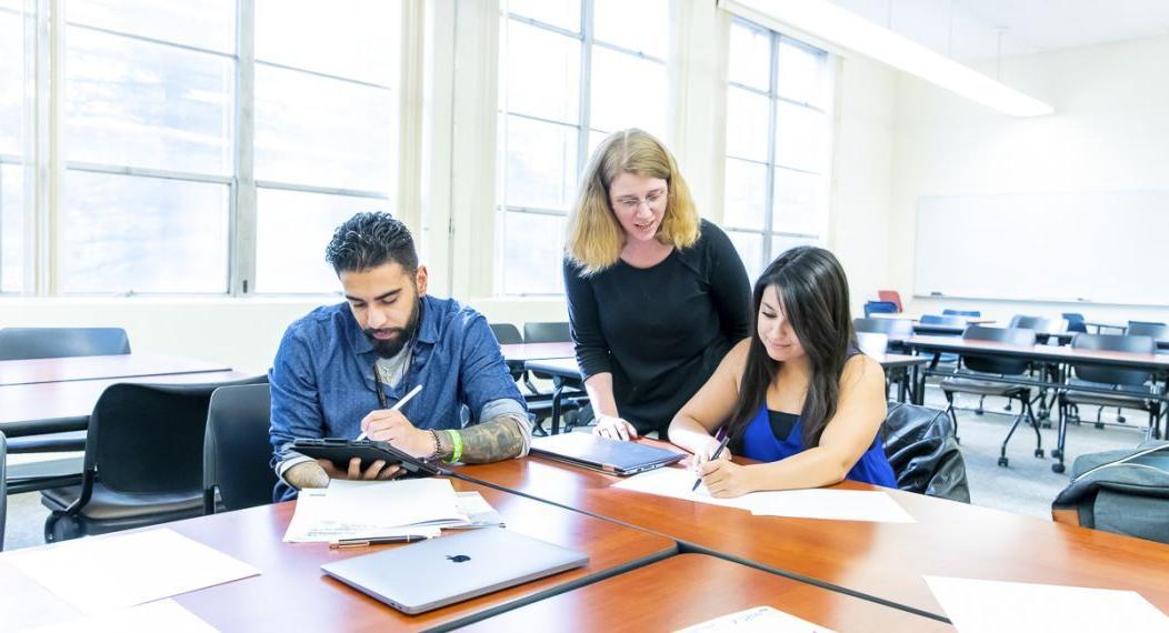 professor with students in classroom